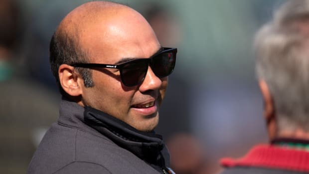 SF Giants president of baseball operations Farhan Zaidi talks with a reporter prior to a game in the 2021 NLDS.